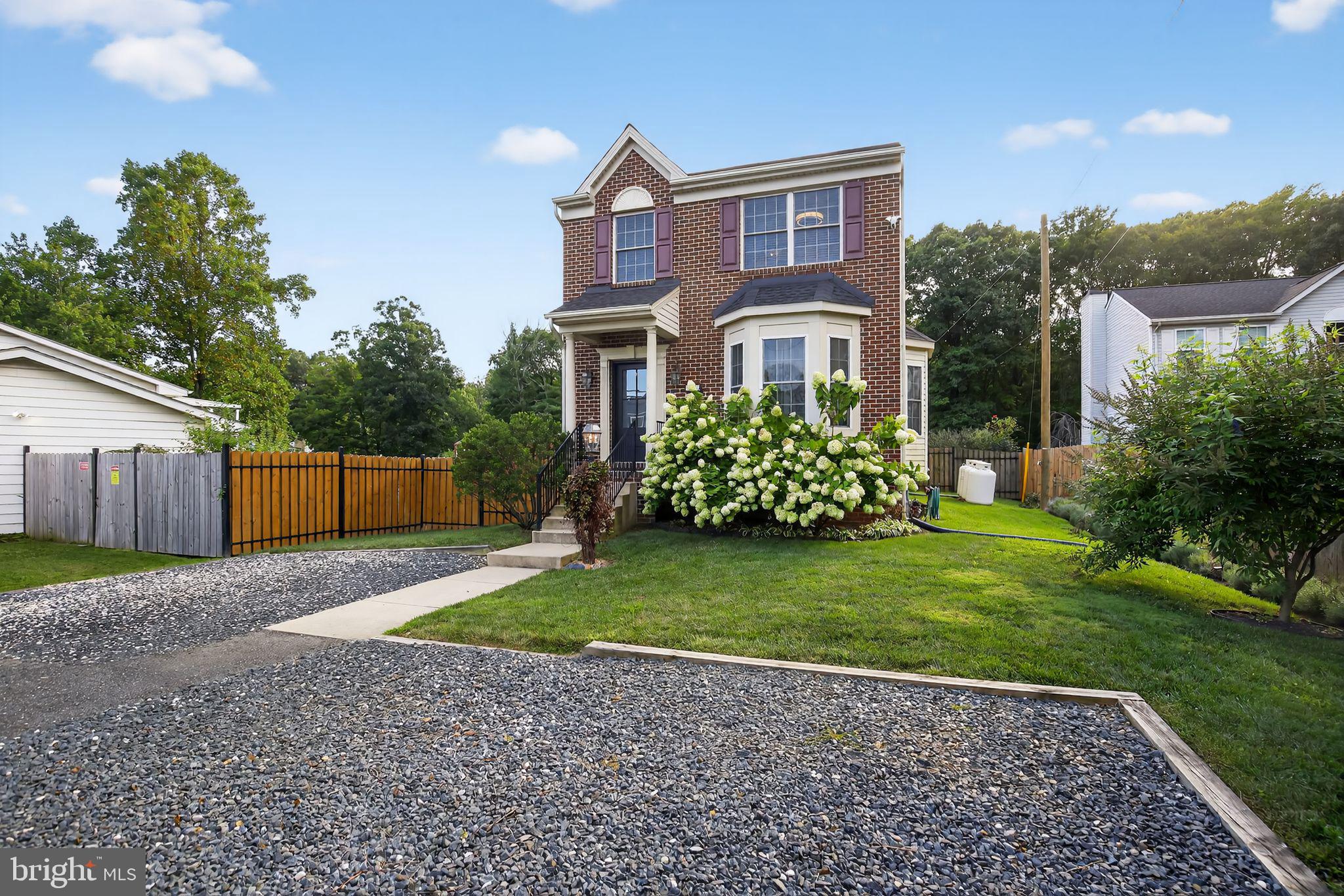 7619 North Point Road Baltimore, MD 21219 - Photo 2 of 61 a front view of a house with garden