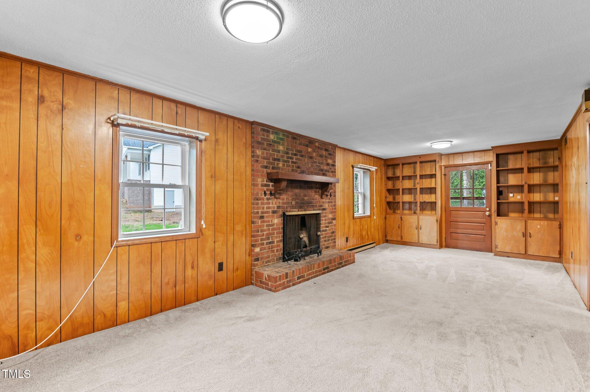 505 Forest Road Oxford, NC 27565 - Photo 15 of 31 a view of an empty room with a fireplace and a window