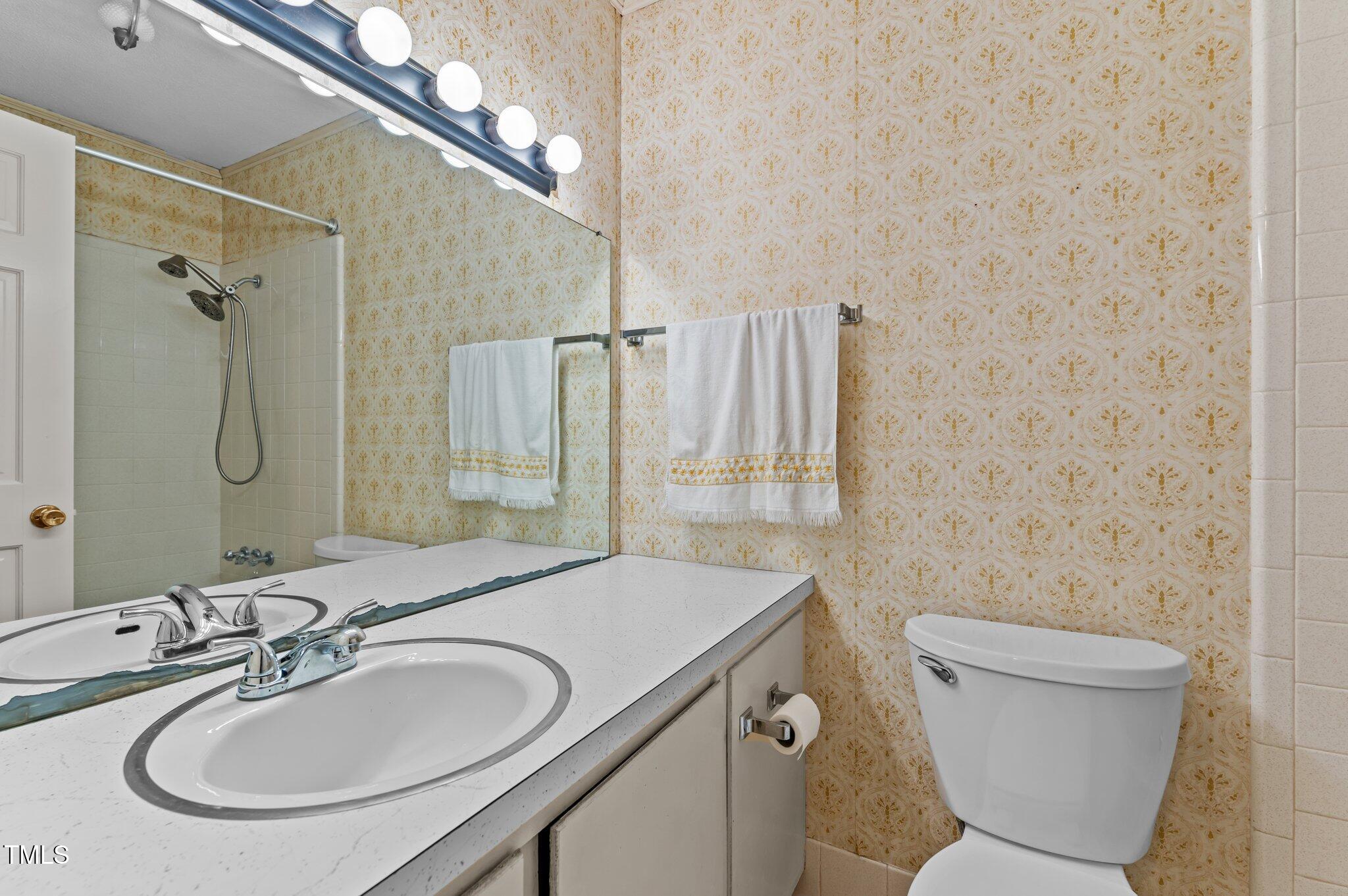 505 Forest Road Oxford, NC 27565 - Photo 19 of 31 a bathroom with a sink a toilet and shower