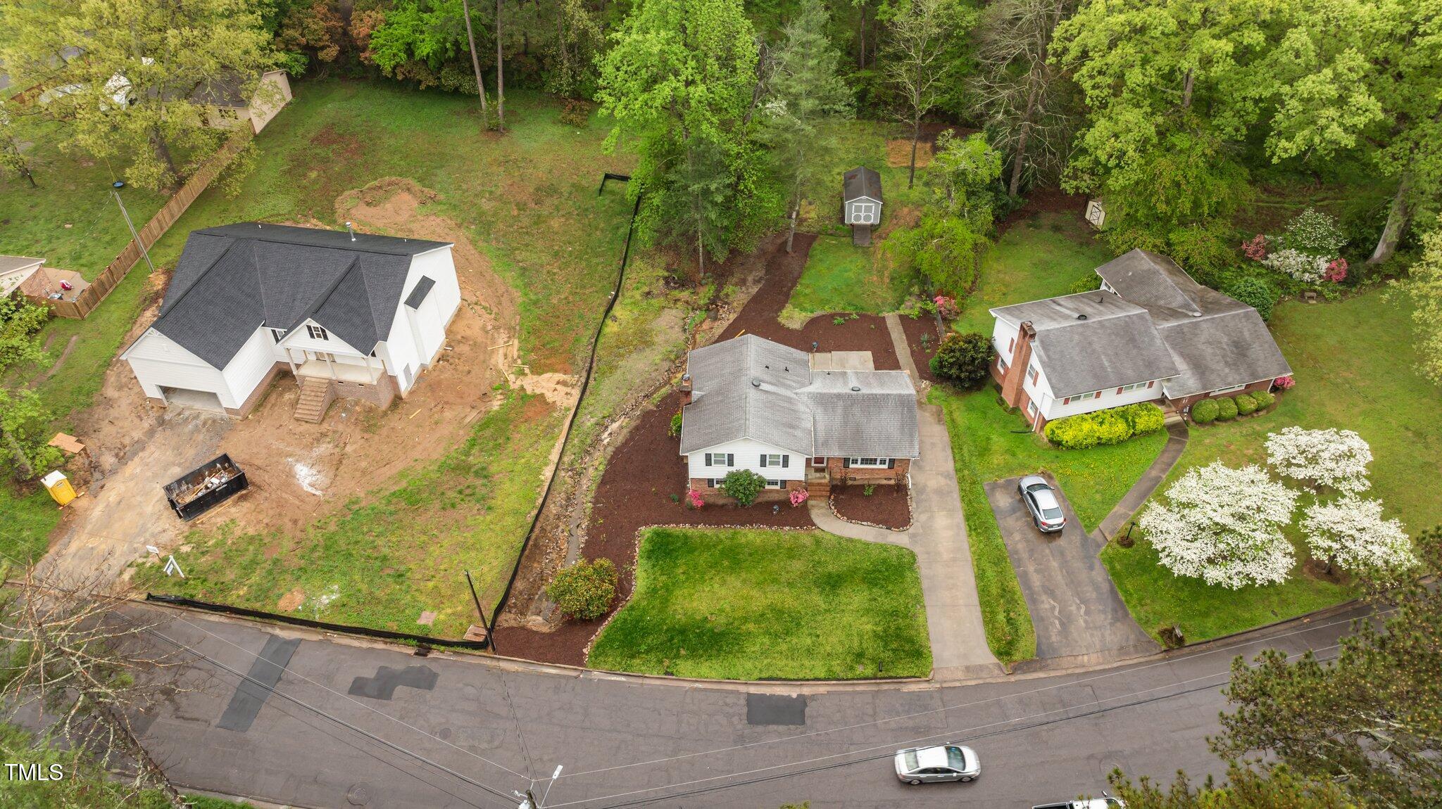 505 Forest Road Oxford, NC 27565 - Photo 2 of 31 an aerial view of a house with a garden and lake view