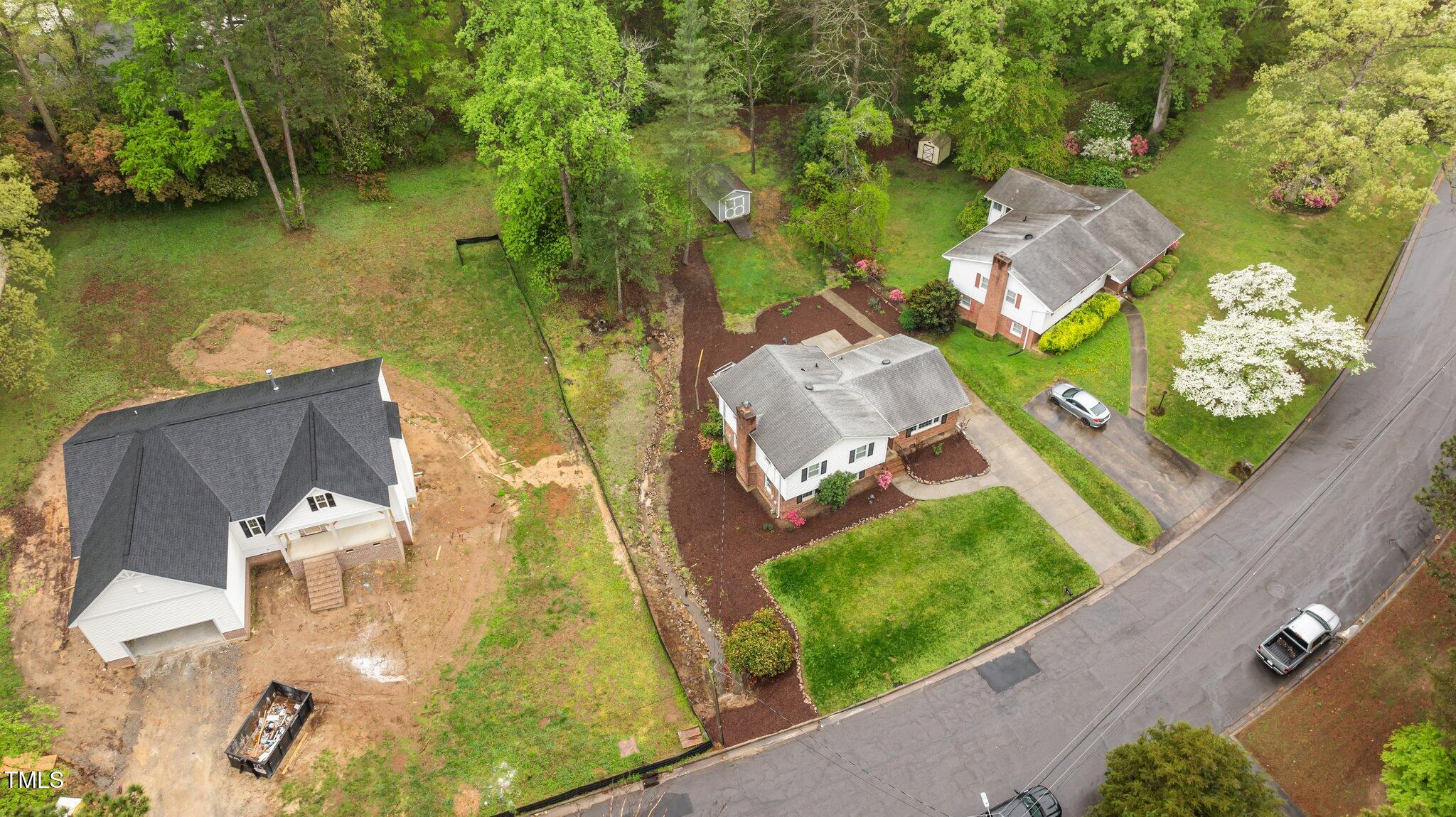 505 Forest Road Oxford, NC 27565 - Photo 24 of 31 an aerial view of a house with a garden and lake view