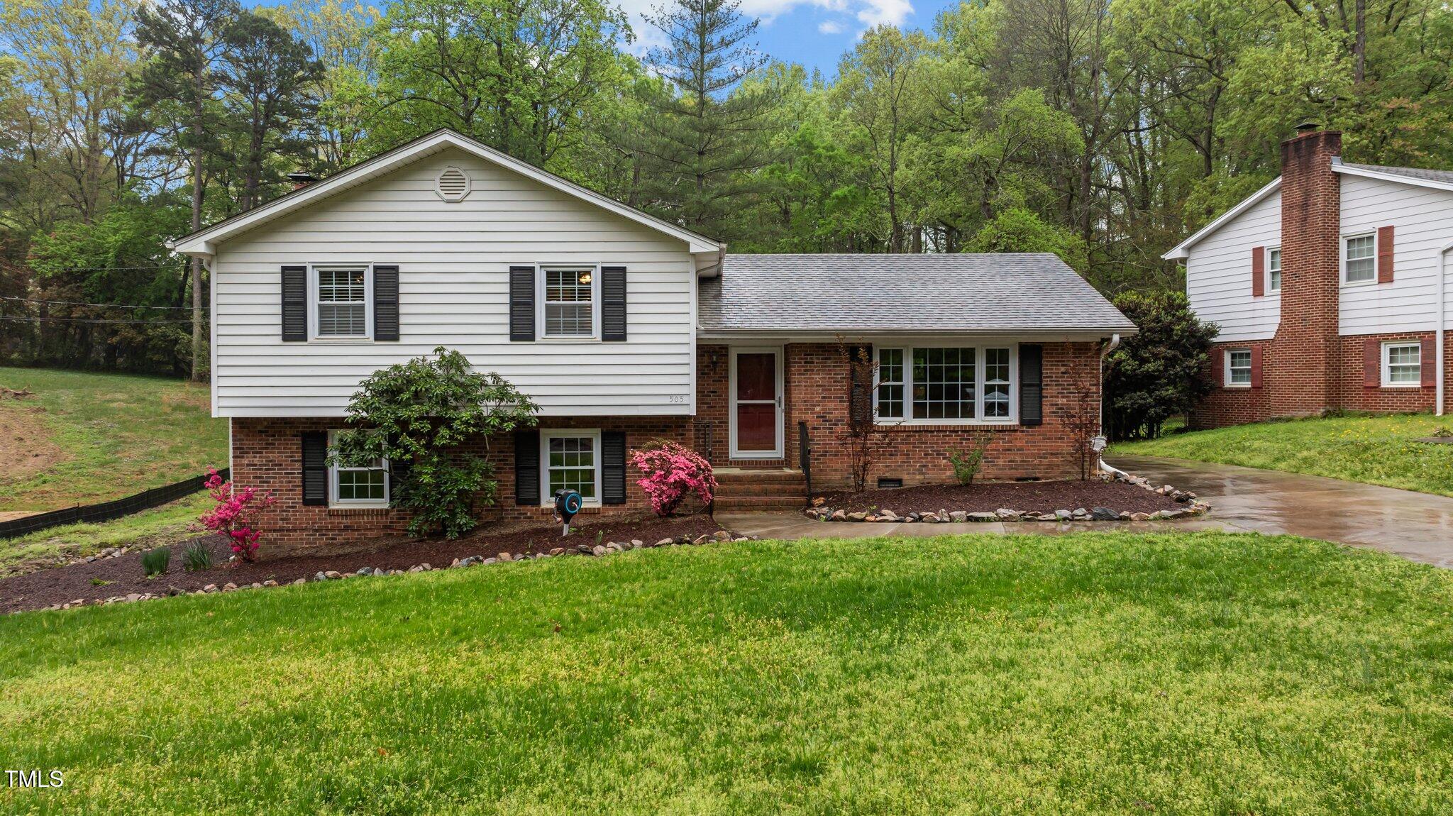 505 Forest Road Oxford, NC 27565 - Photo 28 of 31 a front view of a house with a yard and outdoor seating