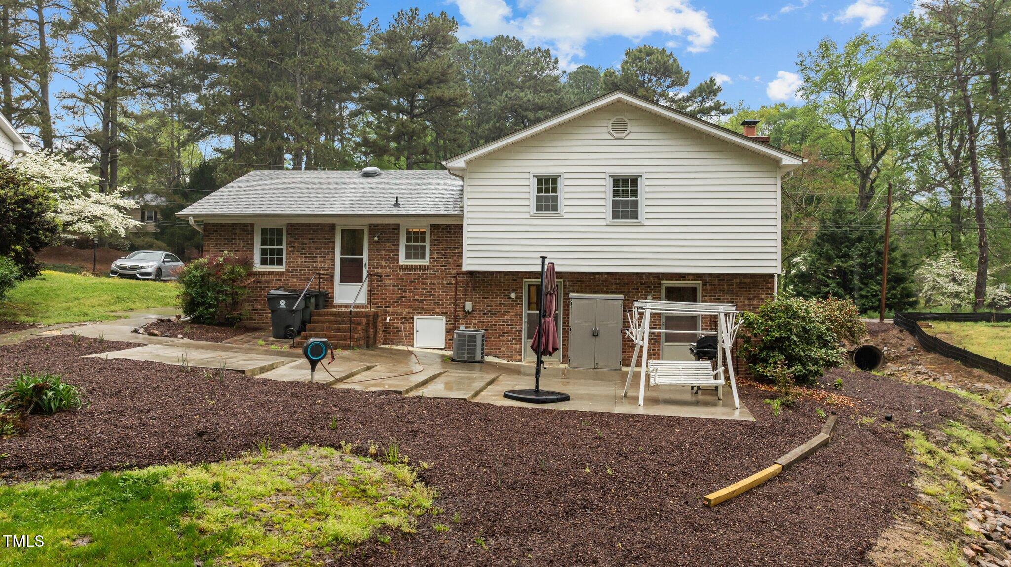 505 Forest Road Oxford, NC 27565 - Photo 30 of 31 a view of a house with backyard and chairs
