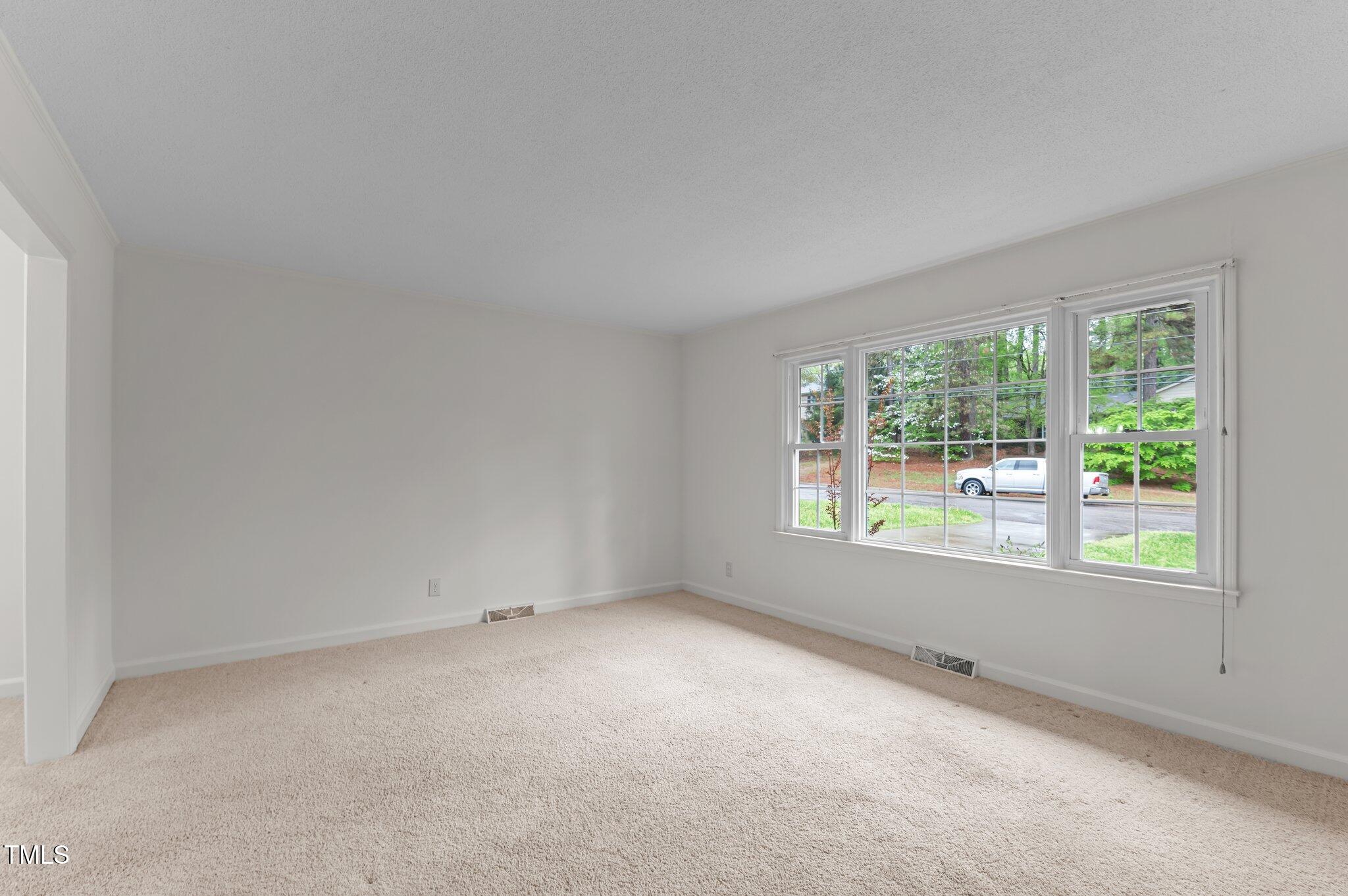 505 Forest Road Oxford, NC 27565 - Photo 4 of 31 an empty room with a window