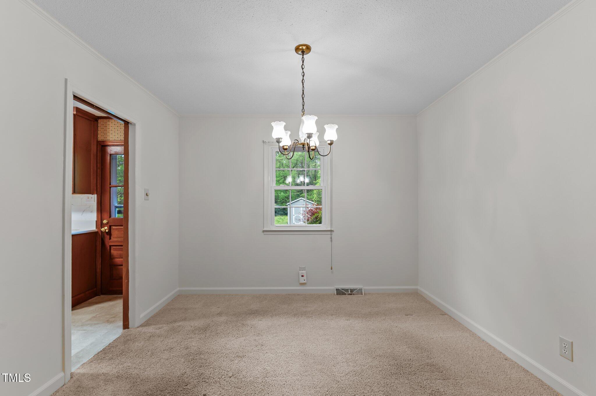 505 Forest Road Oxford, NC 27565 - Photo 5 of 31 a room that has a window in it