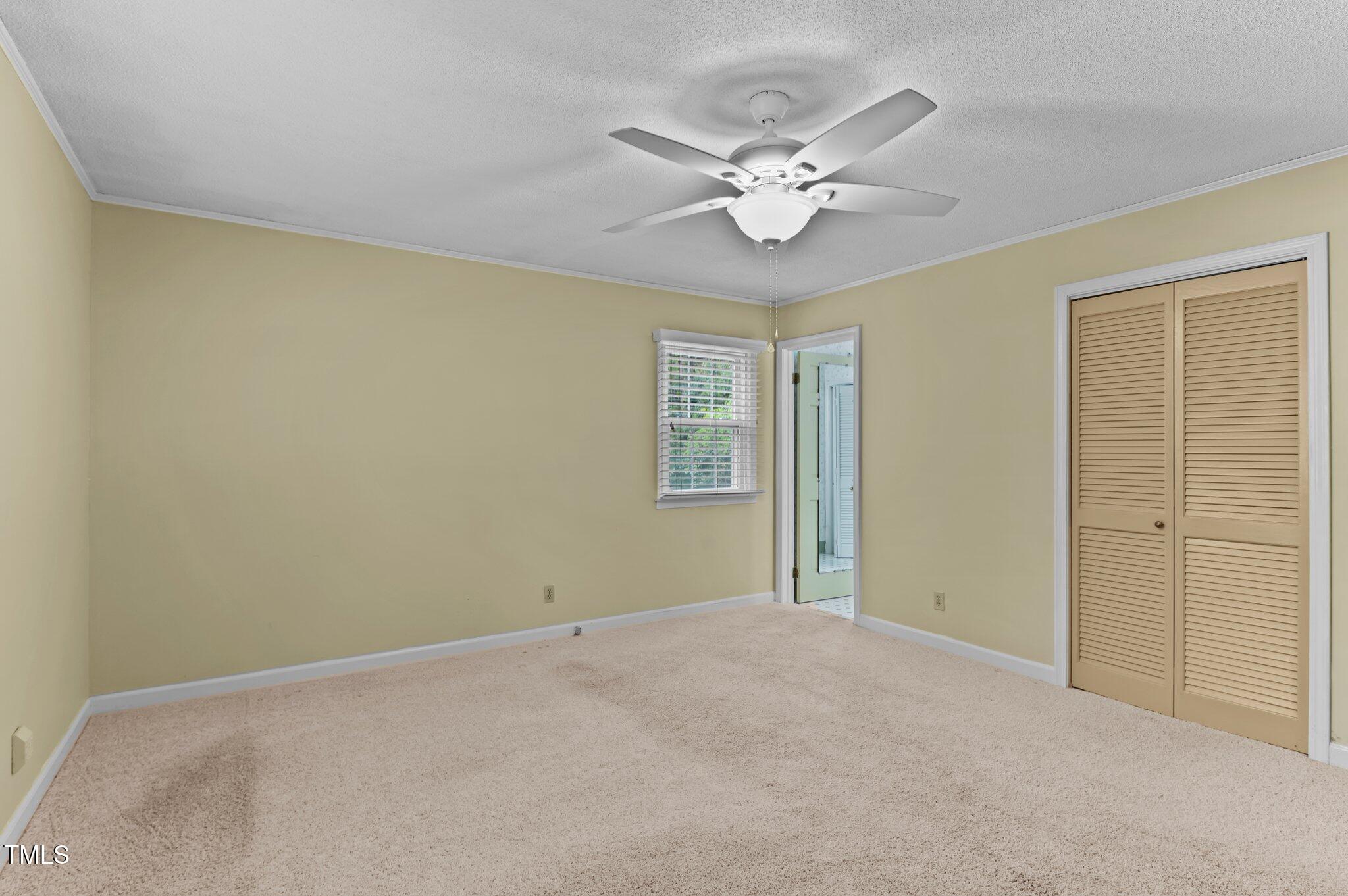 505 Forest Road Oxford, NC 27565 - Photo 10 of 31 a view of an empty room with a chandelier fan