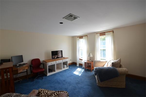 64 North Sturbridge Road Charlton, MA 01507 - Photo 19 of 30 a living room with furniture and a flat screen tv