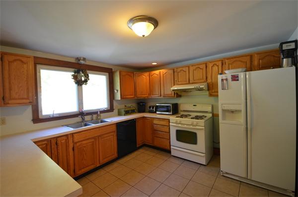64 North Sturbridge Road Charlton, MA 01507 - Photo 3 of 30 a kitchen with stainless steel appliances granite countertop a stove a sink and a refrigerator