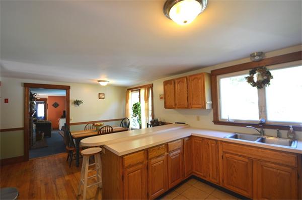 64 North Sturbridge Road Charlton, MA 01507 - Photo 4 of 30 a kitchen with a sink cabinets and wooden floor