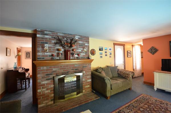 64 North Sturbridge Road Charlton, MA 01507 - Photo 10 of 30 a living room with furniture and a fireplace