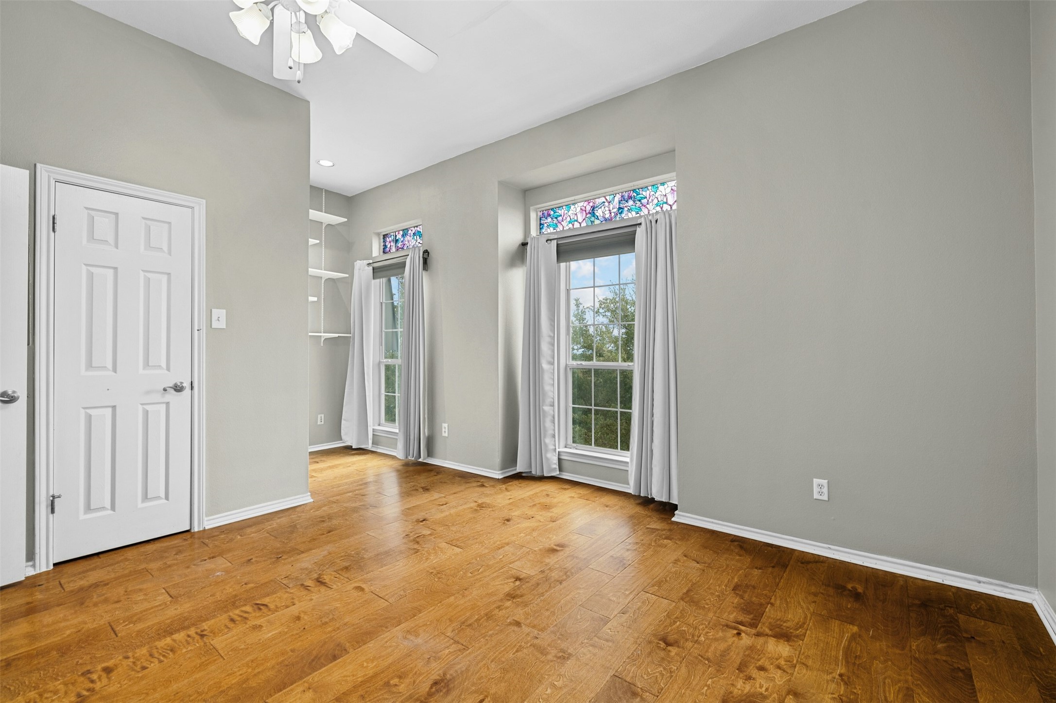 2918 Ranch To Market Road 620, Unit W219 Austin, TX 78734 - Photo 28 of 35 Built-in shelves and dramatic windows add character and light to the secondary bedroom.