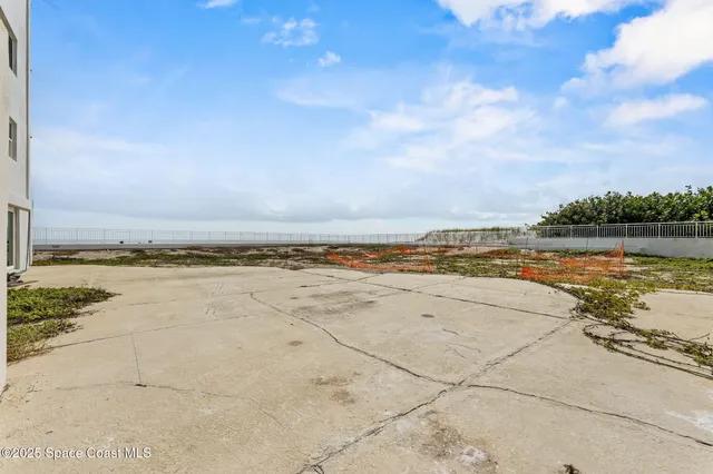 a view of a swimming pool with furniture
