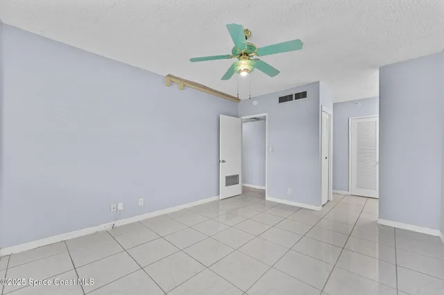 a kitchen with granite countertop a sink a counter top space appliances and cabinets