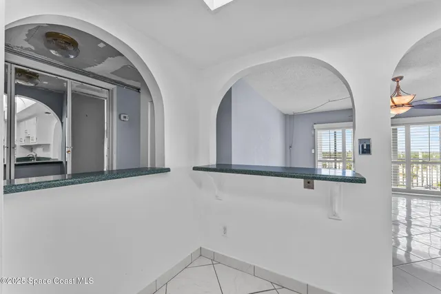 a building with car parked in front of it