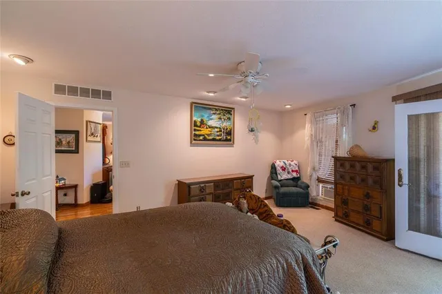 a bedroom with a bed and furniture