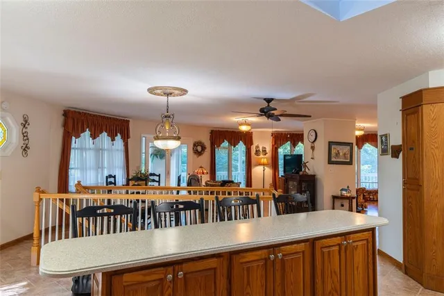 a dining room with furniture window and wooden floor