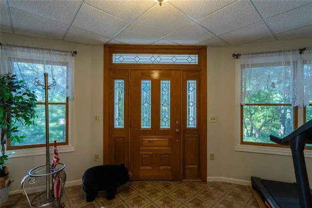 a bedroom with a bed and a chair