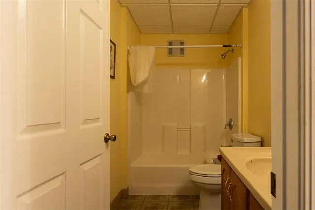 a bathroom with a shower and a toilet