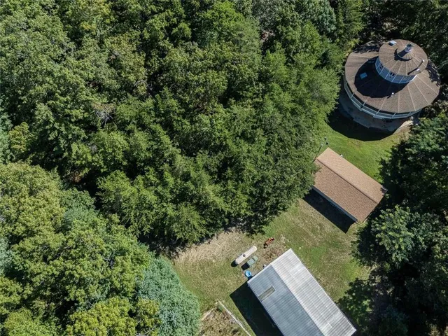an aerial view of a house with garden space and sitting space