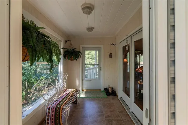 a view of hallway with wooden floor