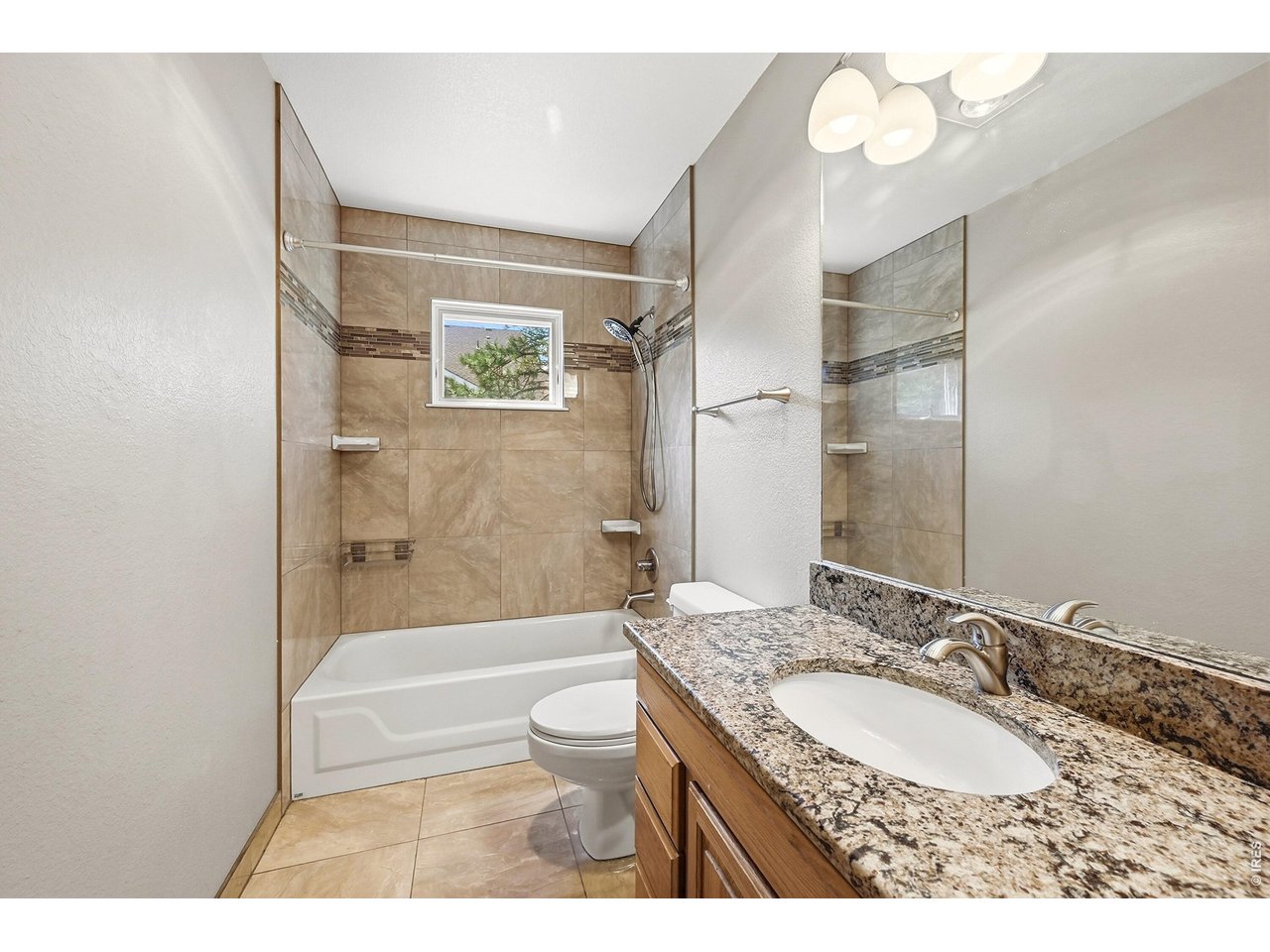 256 Choctaw Road Lyons, CO 80540 - Photo 23 of 50 a bathroom with a granite countertop sink toilet and shower