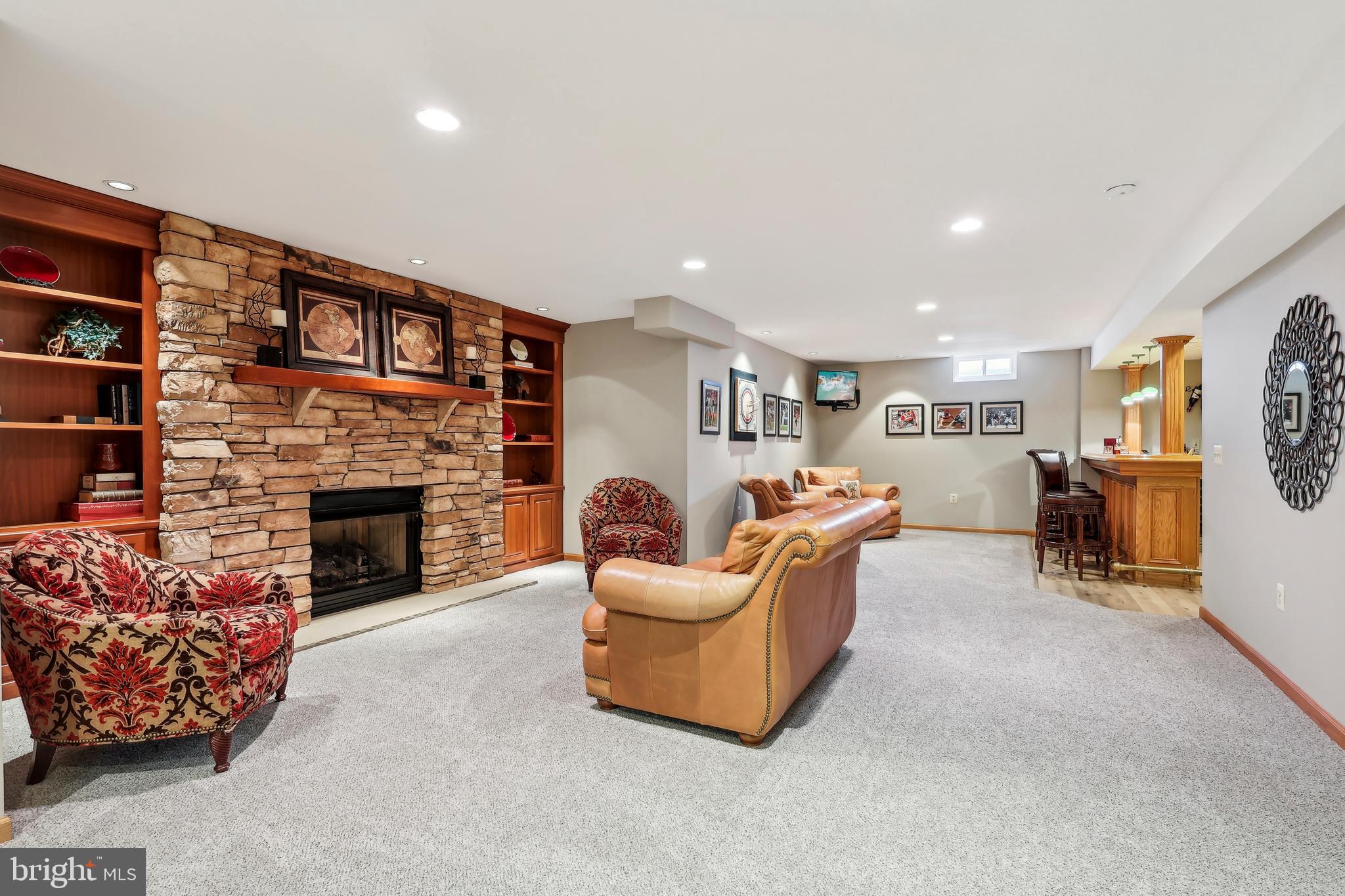 3 Eagleton Farm Road Newtown, PA 18940 - Photo 22 of 40 a living room with furniture and a fireplace