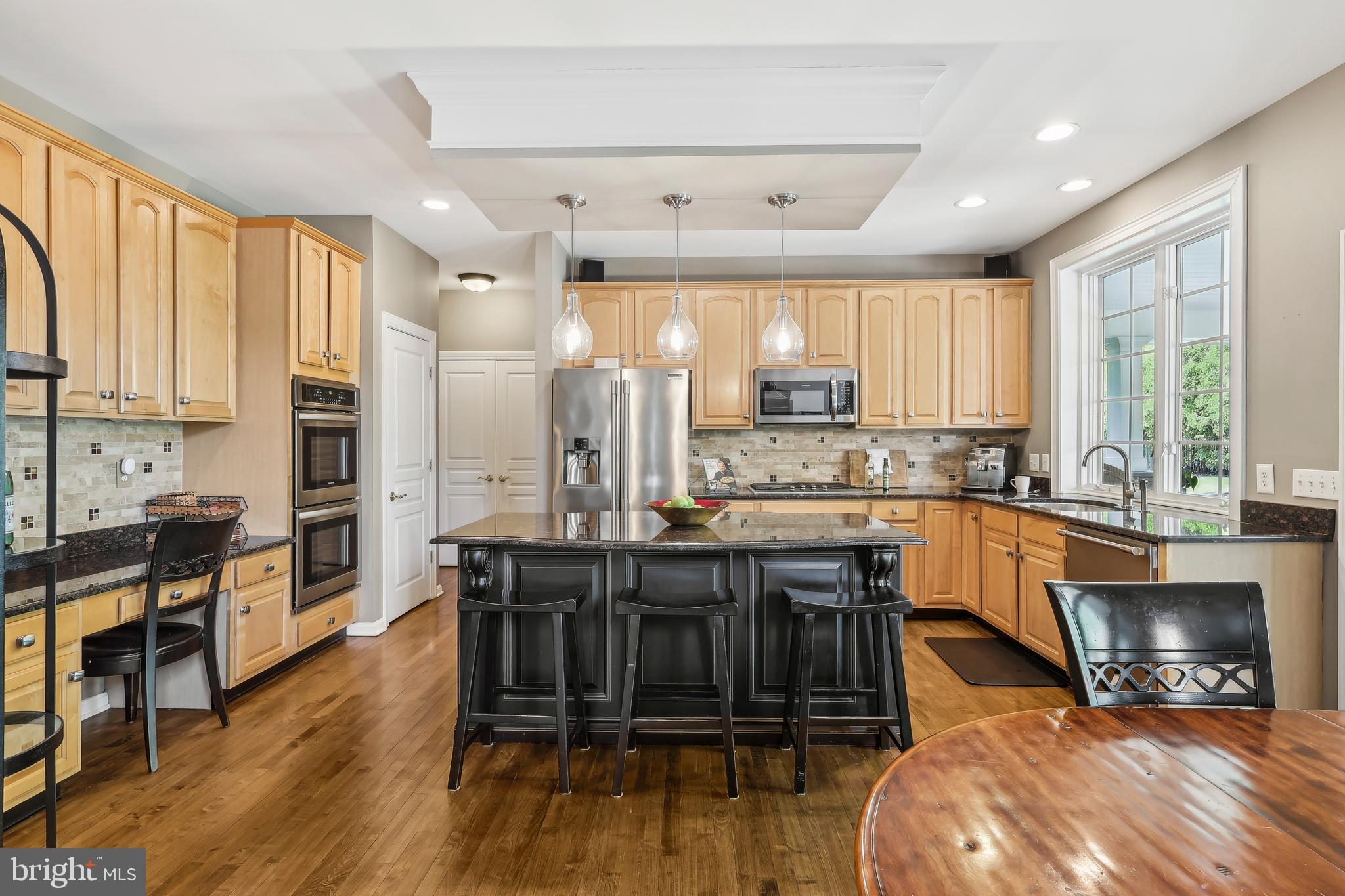 3 Eagleton Farm Road Newtown, PA 18940 - Photo 8 of 40 a large kitchen with lots of counter space dining table and a large window