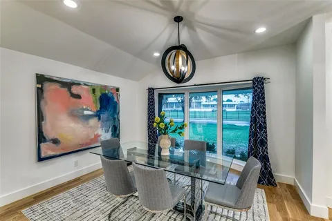 a view of a dining room with furniture window and chandelier