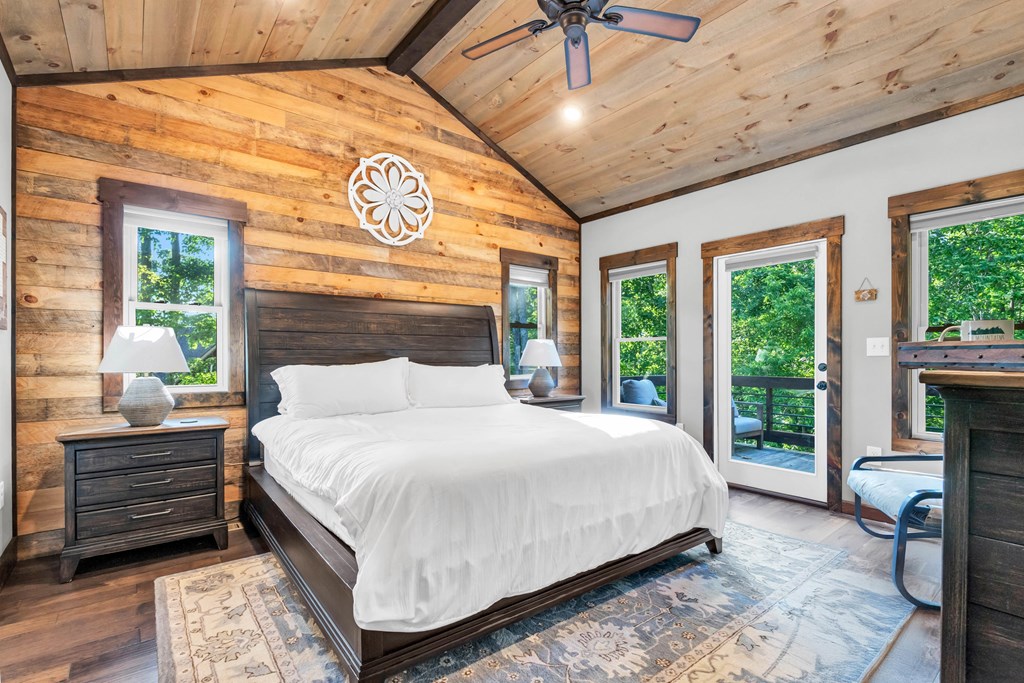 566 High Meadows Drive Morganton, GA 30560 - Photo 15 of 46 a bedroom with a large bed and a large window