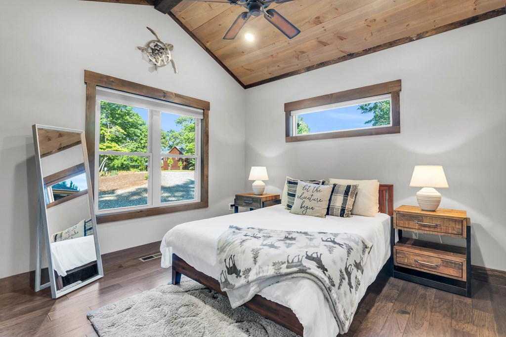 566 High Meadows Drive Morganton, GA 30560 - Photo 18 of 46 a bedroom with a bed and a large window