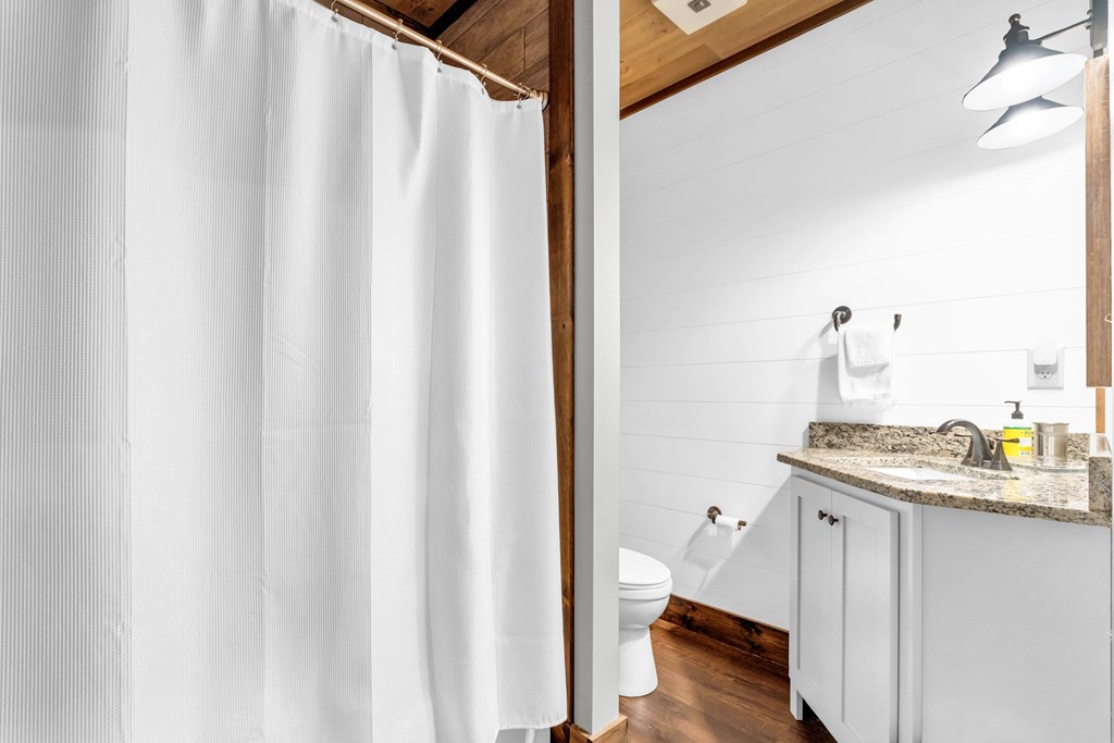 566 High Meadows Drive Morganton, GA 30560 - Photo 28 of 46 a bathroom with a granite countertop sink and a mirror