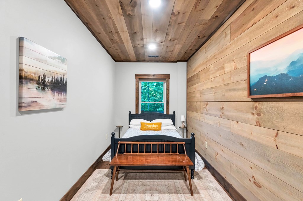 566 High Meadows Drive Morganton, GA 30560 - Photo 30 of 46 a wooden bench sitting in front of a window