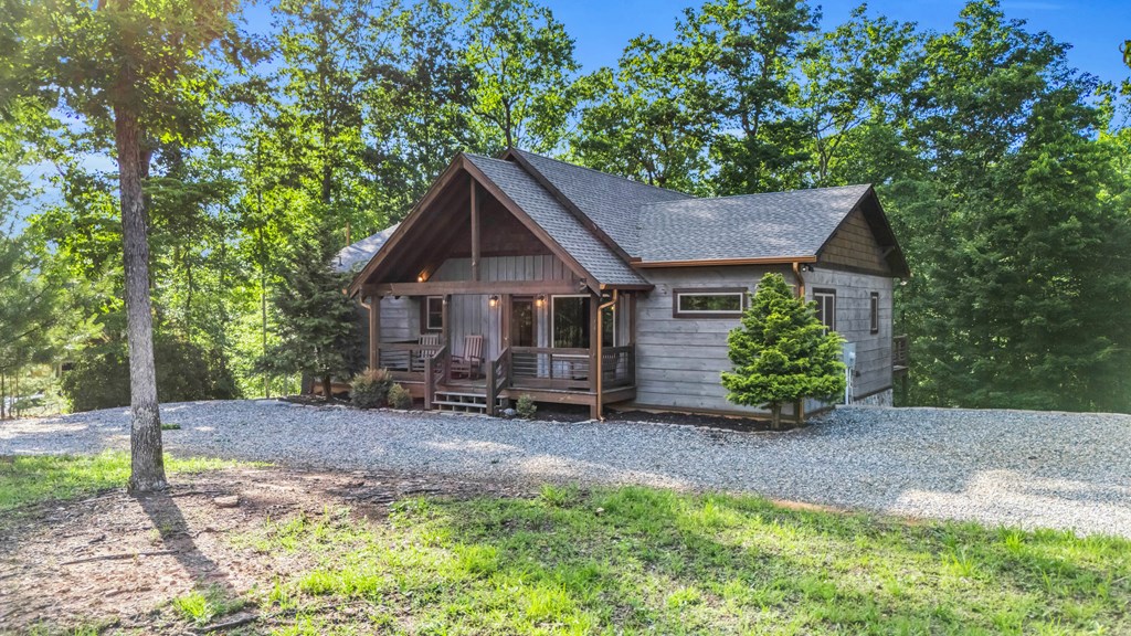 566 High Meadows Drive Morganton, GA 30560 - Photo 5 of 46 a house with a tree in front of it