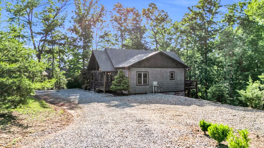 566 High Meadows Drive Morganton, GA 30560 - Photo 6 of 46 a house with a tree in front of it