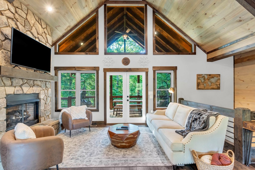 566 High Meadows Drive Morganton, GA 30560 - Photo 9 of 46 a living room with fireplace furniture and a flat screen tv