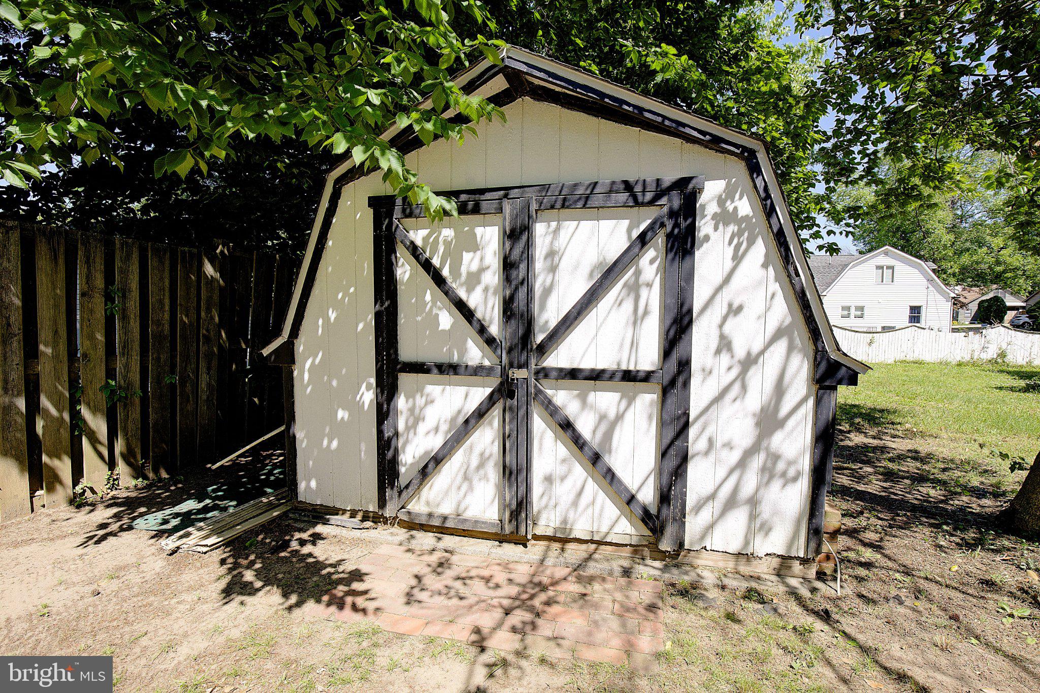 1718 Ridgely Road Edgewater, MD 21037 - Photo 17 of 19 Charming garden shed in dappled light.
