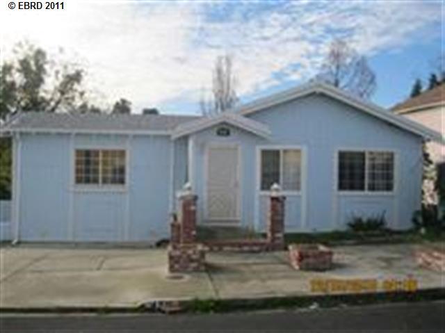 450 Garretson Avenue Rodeo, CA 94572 - Photo 1 of 1 a front view of a house with garden