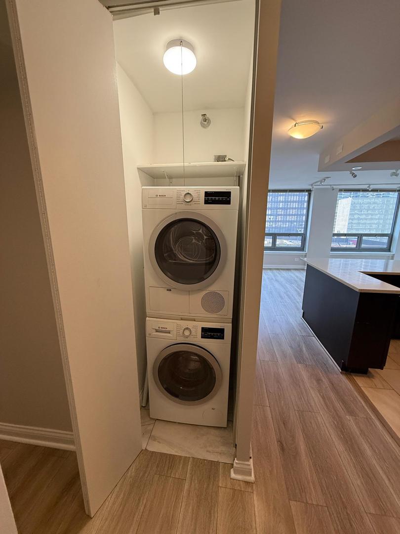 440 North Wabash Avenue, Unit 1605 Chicago, IL 60611 - Photo 22 of 53 a view of a hallway with washer and dryer