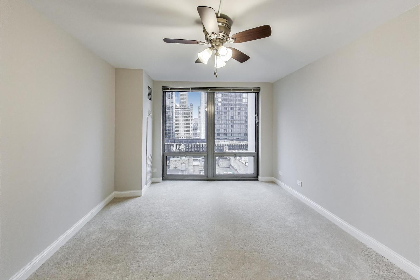 440 North Wabash Avenue, Unit 1605 Chicago, IL 60611 - Photo 23 of 53 a view of an empty room with a window