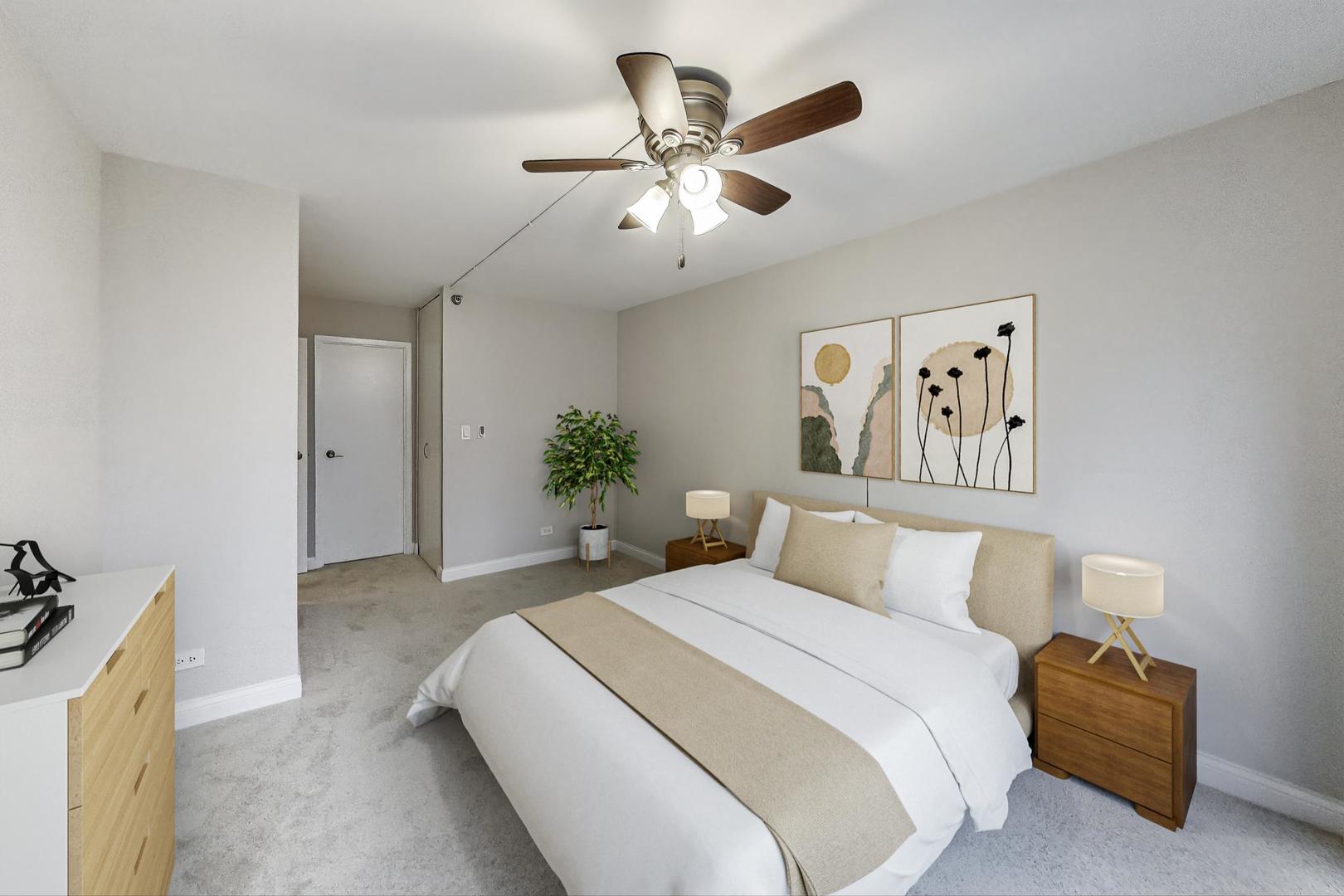 440 North Wabash Avenue, Unit 1605 Chicago, IL 60611 - Photo 25 of 53 a bedroom with a bed and a chandelier