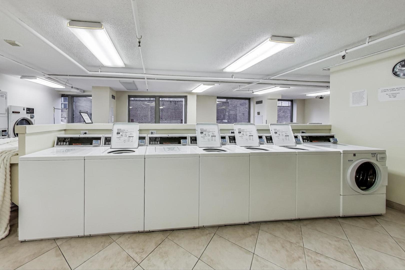 440 North Wabash Avenue, Unit 1605 Chicago, IL 60611 - Photo 32 of 53 a kitchen with stainless steel appliances granite countertop a stove a sink and a microwave