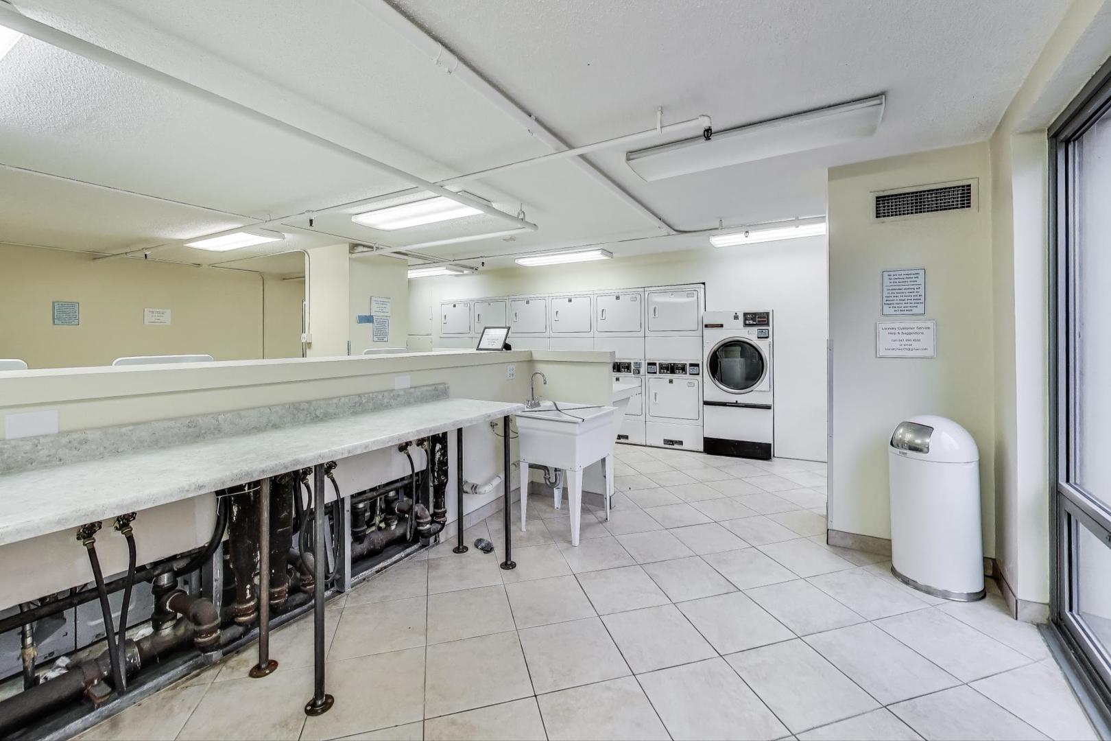 440 North Wabash Avenue, Unit 1605 Chicago, IL 60611 - Photo 33 of 53 a large white kitchen with a large window