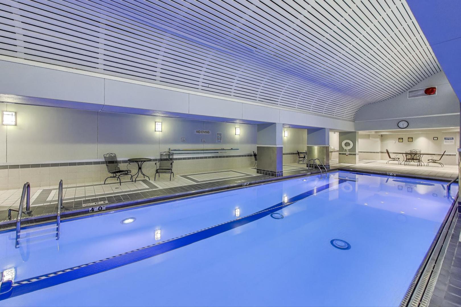 440 North Wabash Avenue, Unit 1605 Chicago, IL 60611 - Photo 40 of 53 a kitchen with stainless steel appliances granite countertop a sink a stove and granite countertops