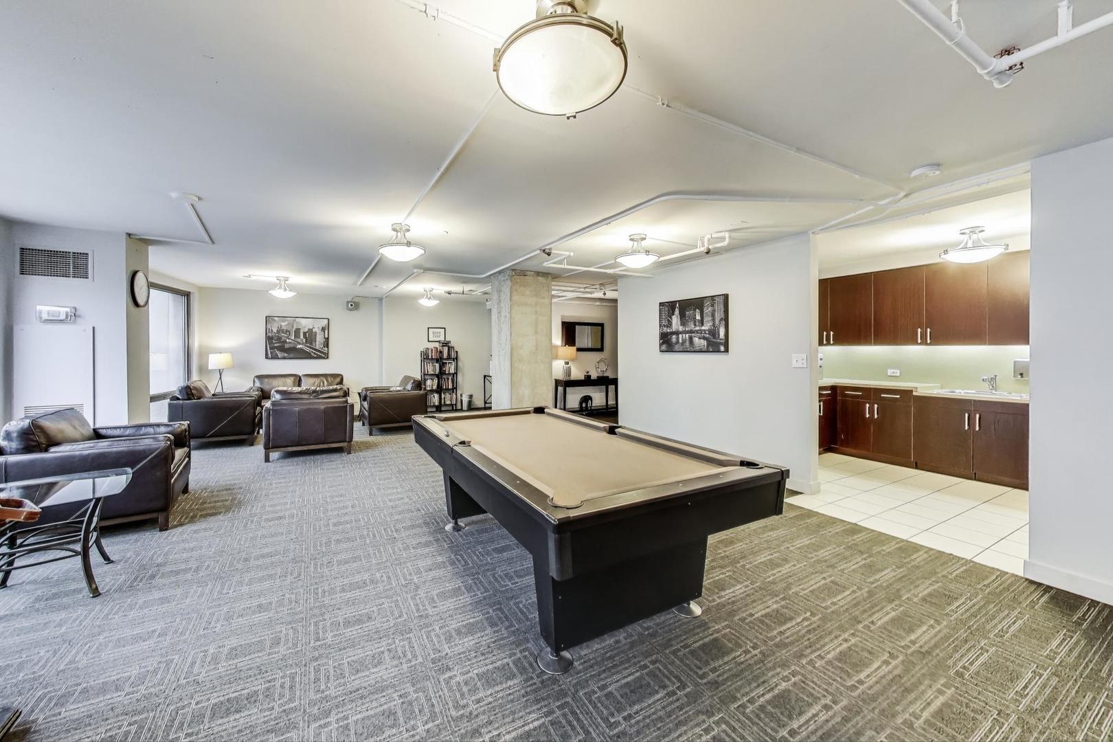 440 North Wabash Avenue, Unit 1605 Chicago, IL 60611 - Photo 42 of 53 a room with lots of furniture and wooden floor