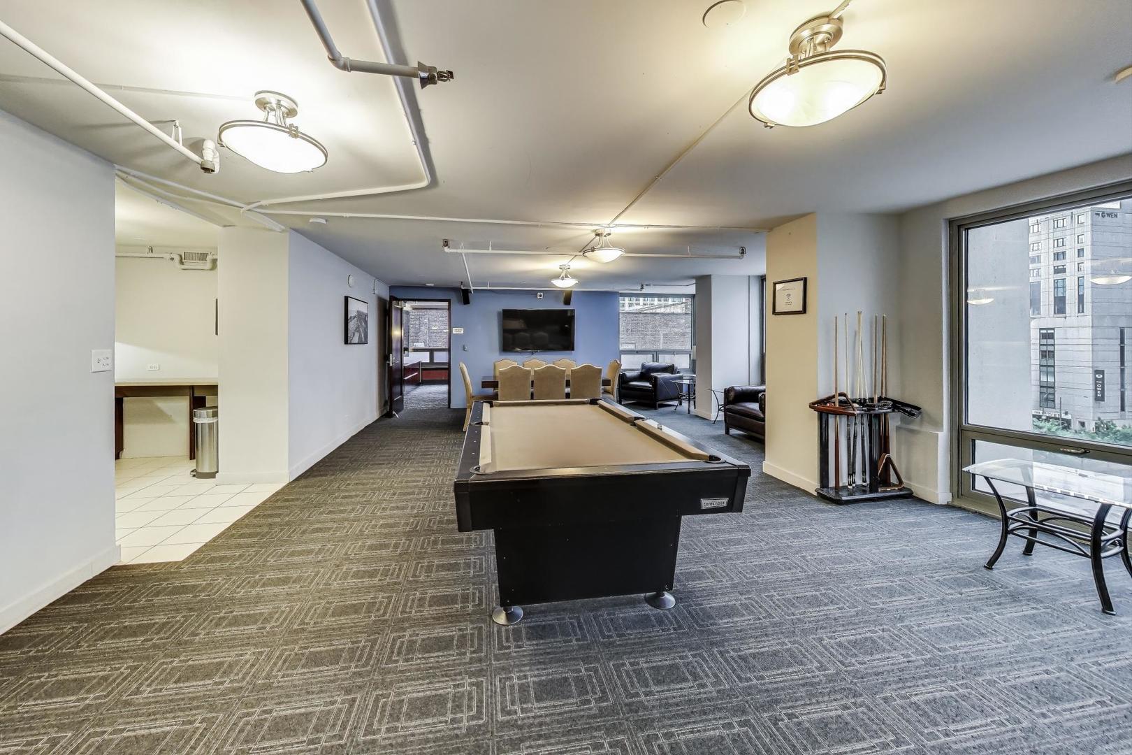 440 North Wabash Avenue, Unit 1605 Chicago, IL 60611 - Photo 44 of 53 a living room with furniture and a table