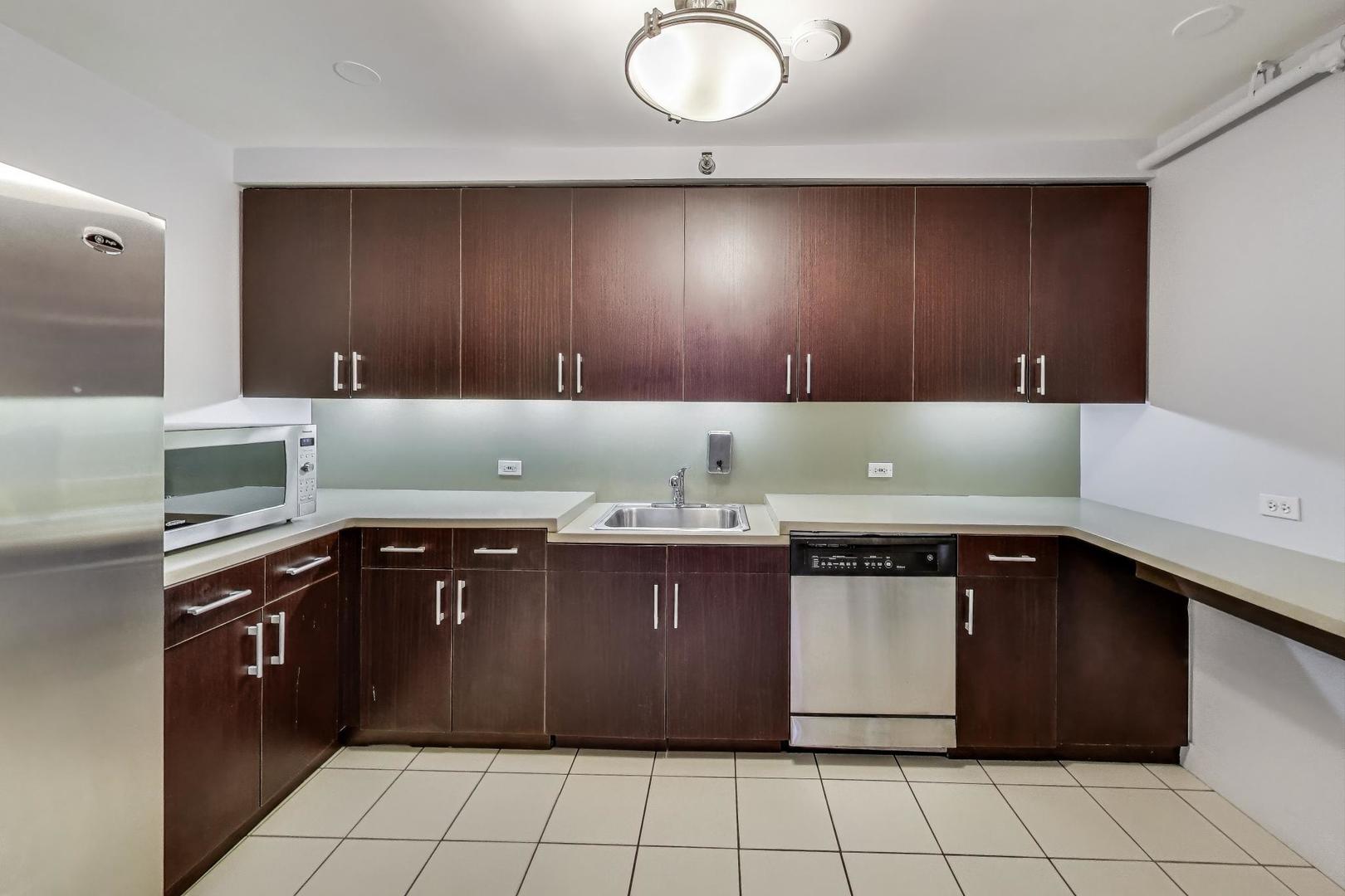 440 North Wabash Avenue, Unit 1605 Chicago, IL 60611 - Photo 46 of 53 a kitchen with a cabinets and a sink