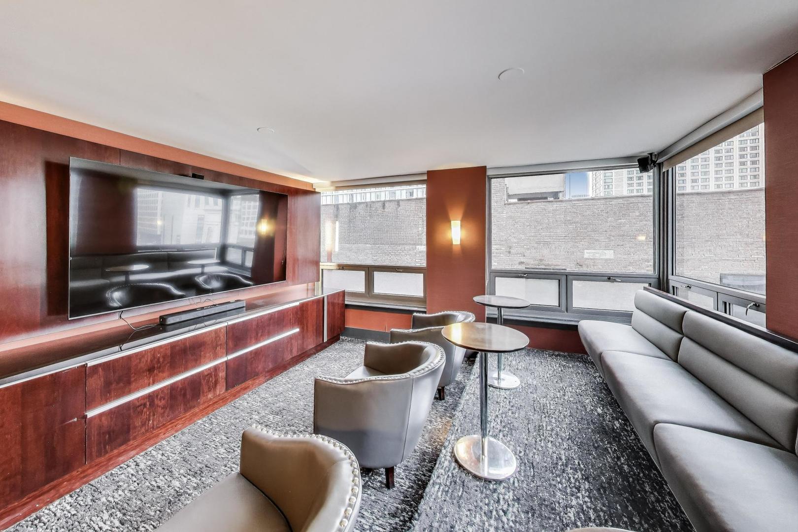 440 North Wabash Avenue, Unit 1605 Chicago, IL 60611 - Photo 47 of 53 a living room with furniture and a flat screen tv