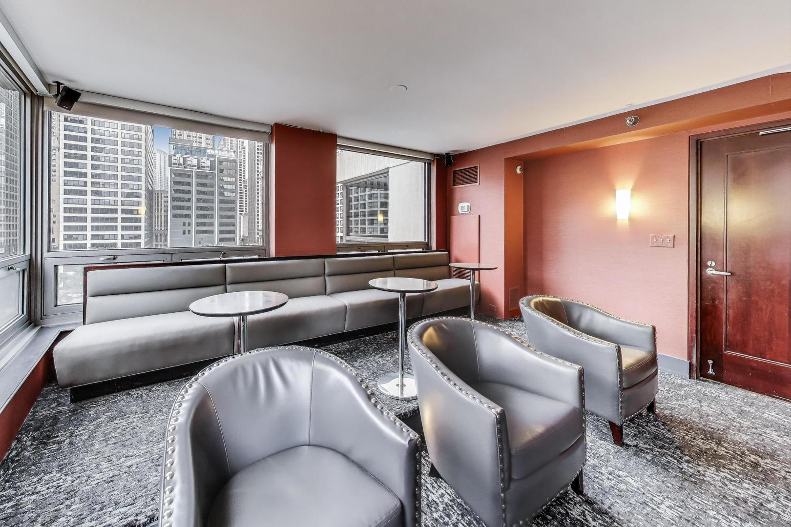 440 North Wabash Avenue, Unit 1605 Chicago, IL 60611 - Photo 48 of 53 a living room with furniture and a large window