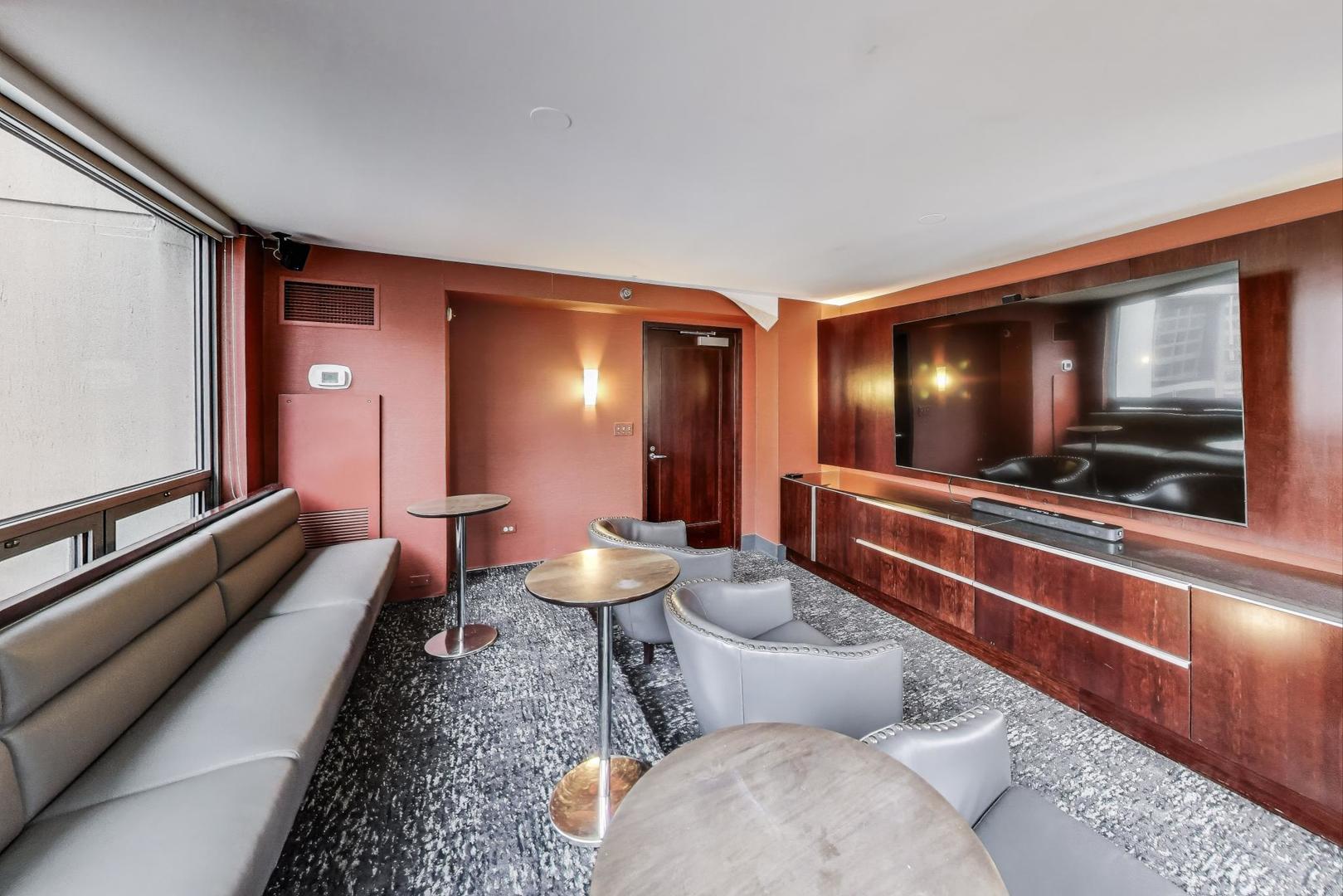 440 North Wabash Avenue, Unit 1605 Chicago, IL 60611 - Photo 49 of 53 a living room with furniture and a flat screen tv