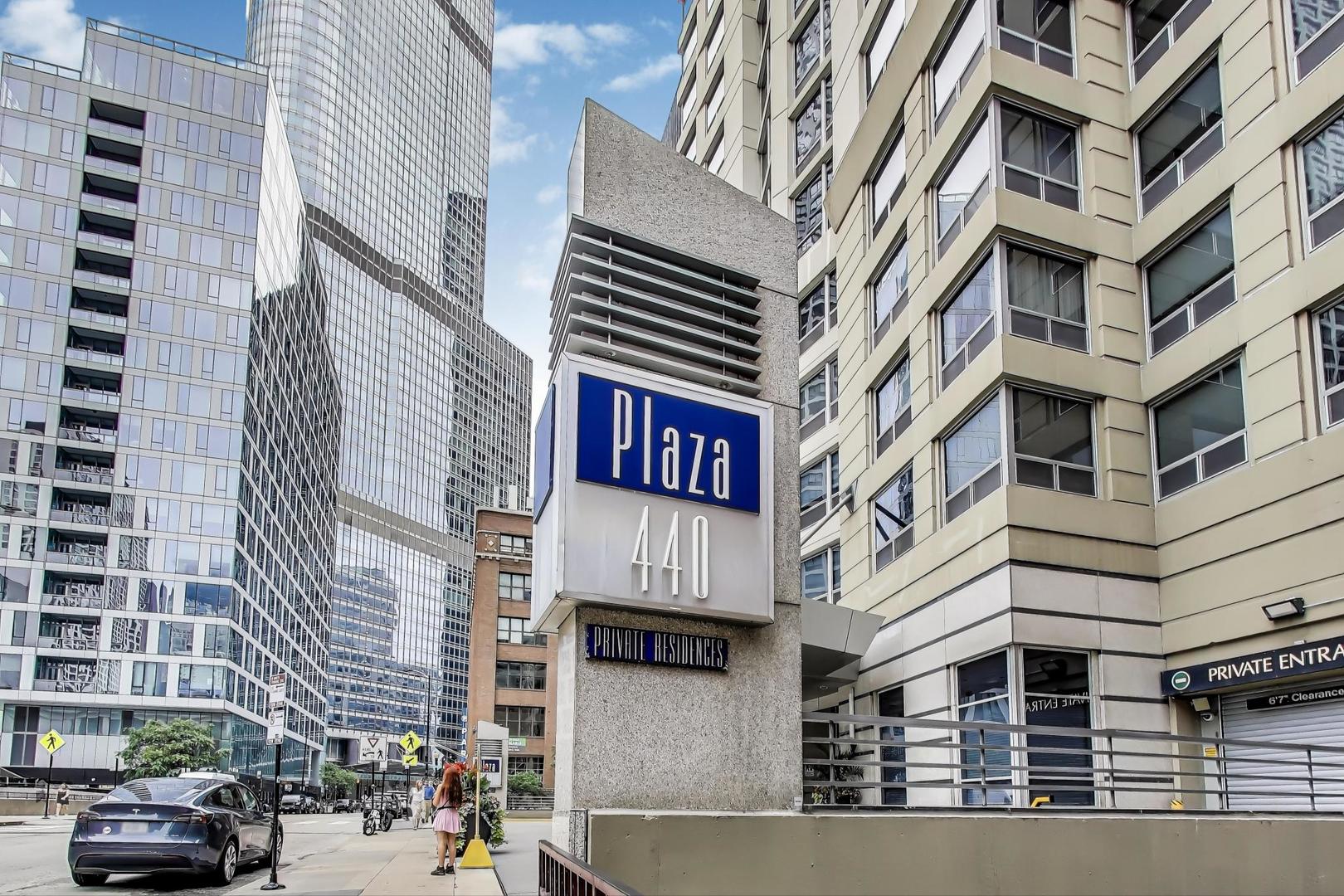 440 North Wabash Avenue, Unit 1605 Chicago, IL 60611 - Photo 6 of 53 a front view of a building with lot of cars and trees